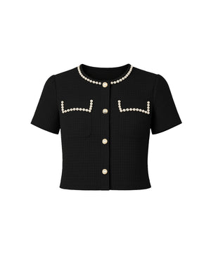 Black short-sleeve blouse with pearl embellishments on a white background