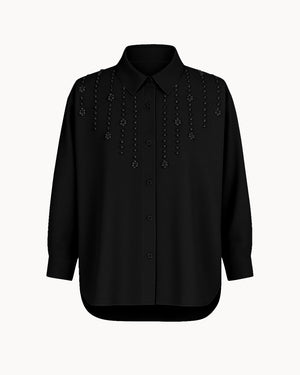 Black shirt with decorative elements on a white background