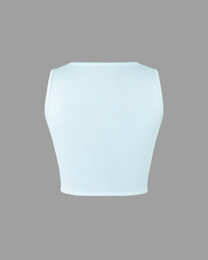 Light blue crop top on a gray background