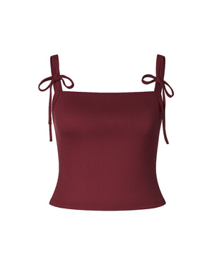 Maroon top with thin straps tied at the shoulder on a white background