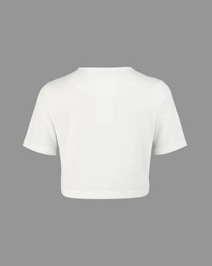 White crop top on a gray background