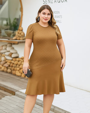 Woman wearing a brown dress standing outdoors with a blurred background