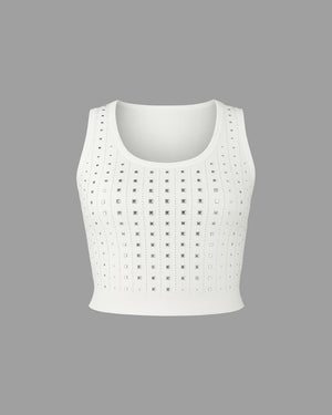 White crop top with perforated design on a gray background