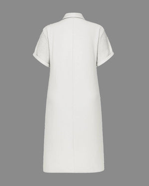 White dress with short sleeves on a gray background