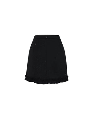 Black skirt with ruffled hem on a white background