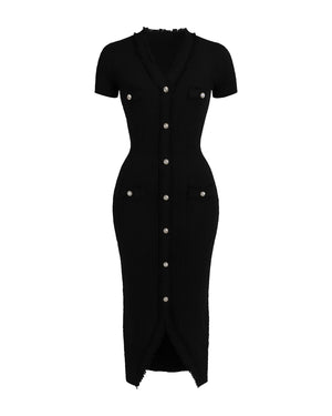 Black dress with white buttons on a white background