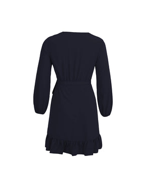 Black dress with long sleeves and ruffled hem on a white background