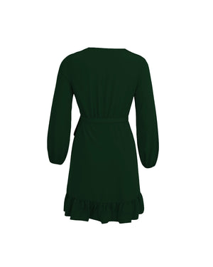 Green dress with a ruffled hem on a white background