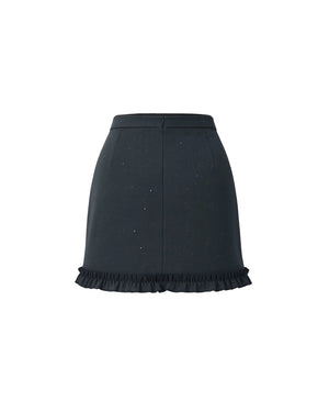 Black skirt with ruffled hem on a white background
