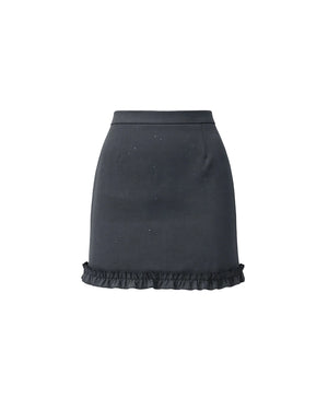 Black skirt with ruffled hem on a white background