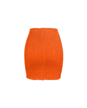 Orange smocked skirt on a white background