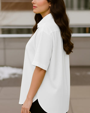 Woman wearing a white blouse with a blurred background