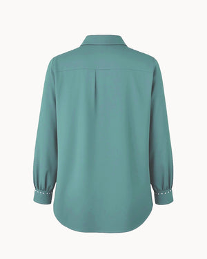 Teal shirt on a white background