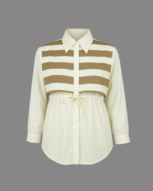 White shirt with brown striped bodice on a gray background