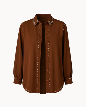 Brown shirt with decorative studs on a white background