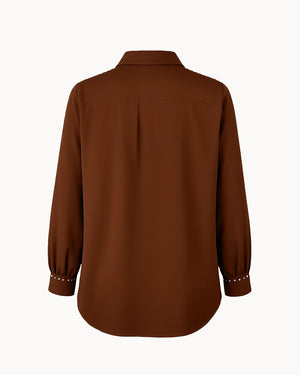 Brown shirt on a white background