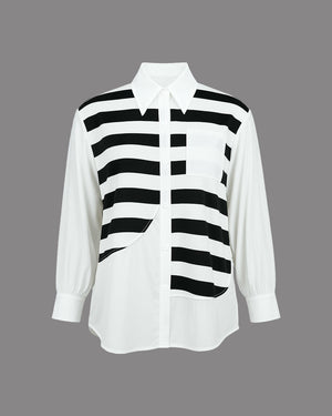 White shirt with black vertical stripes on a gray background