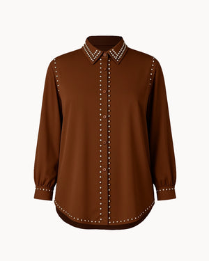 Brown blouse with studded details on a white background
