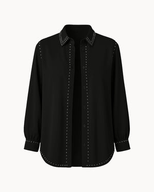 Black shirt with studded details on a white background