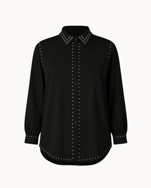 Black shirt with studded details on a white background