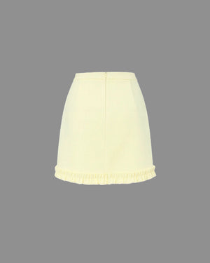 Light yellow skirt on a gray background