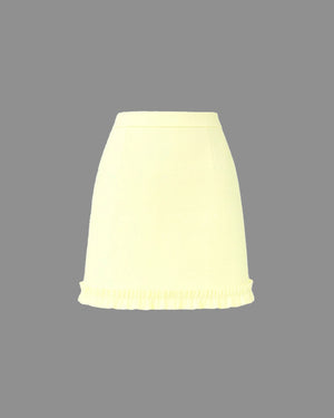 Light yellow skirt on a gray background