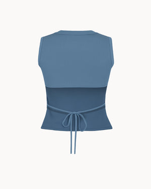 Blue sleeveless top with a tie waist on a white background