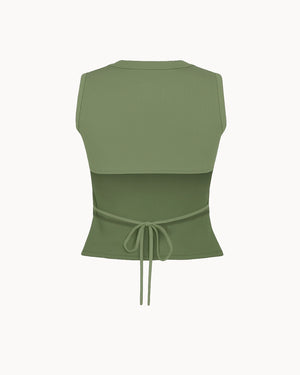 Green sleeveless top with a tie waist on a white background