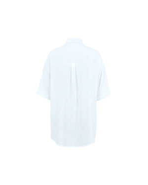 Plain white t-shirt on a light gray background