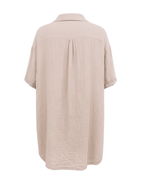 Beige button-up shirt on a white background