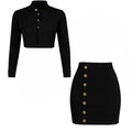 Black long-sleeve crop top and black skirt with gold buttons on a white background