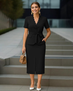 Woman in a black outfit standing outdoors with steps in the background