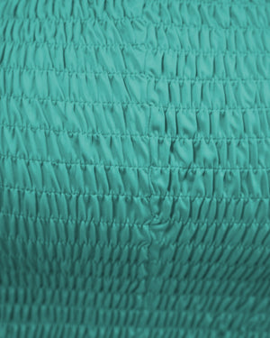 Close-up of textured teal fabric