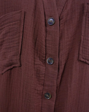 Close-up of a brown textured shirt with buttons