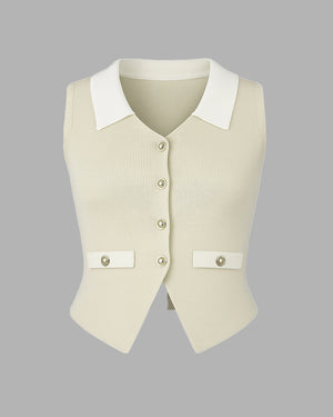 Beige vest with white collar and buttons on a gray background