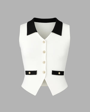 White vest with black collar and trim on a gray background