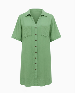 Green button-up shirt with short sleeves on a white background