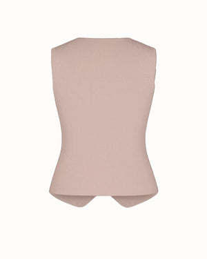 Pink sleeveless top on a white background