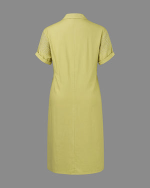 Green dress with short sleeves on a gray background