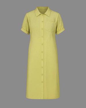 Green dress with short sleeves on a gray background