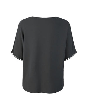 Black blouse with short sleeves on a white background