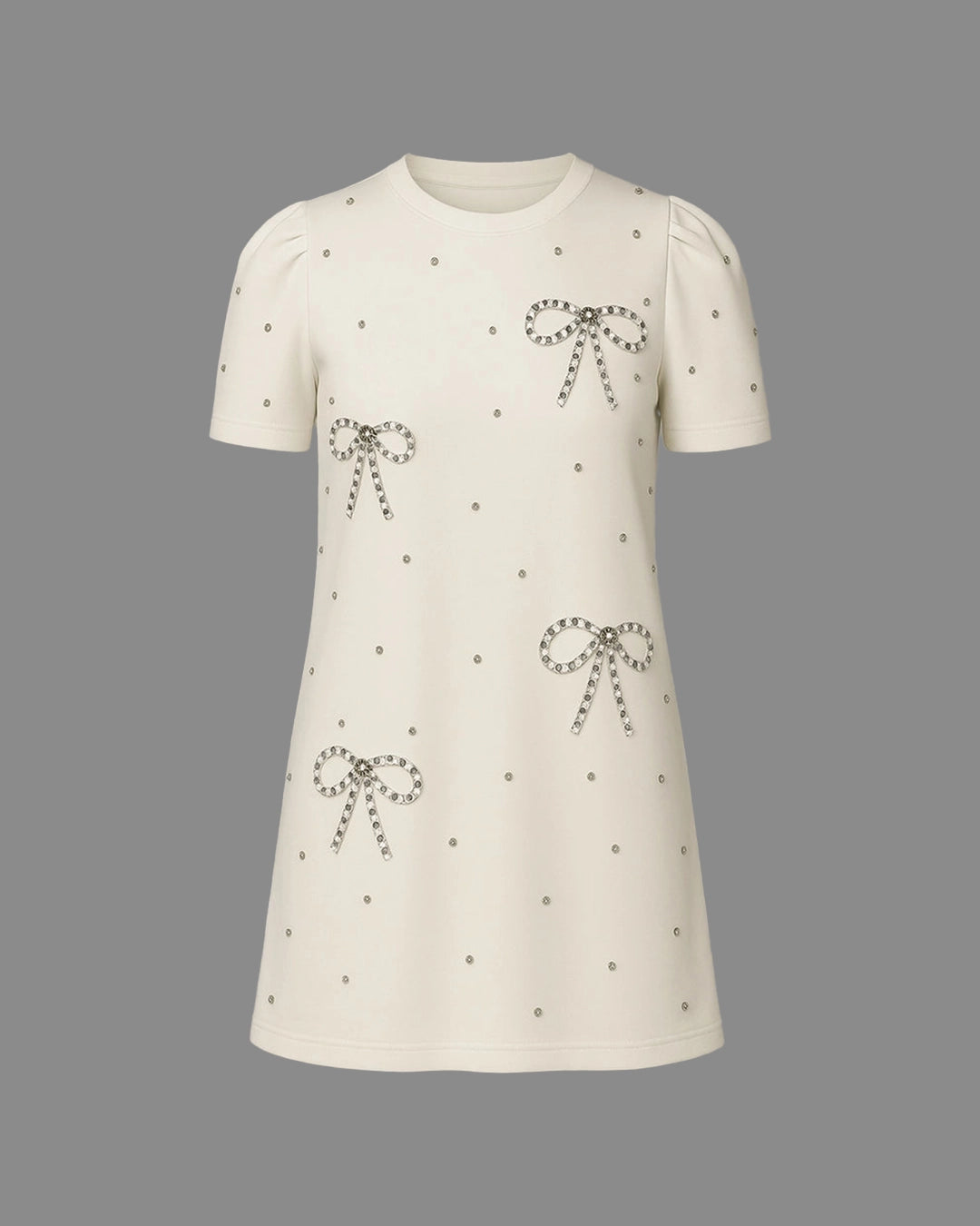 White dress with bow patterns on a gray background