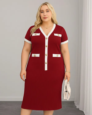 Woman wearing a red dress with white accents and gold buttons against a gray background