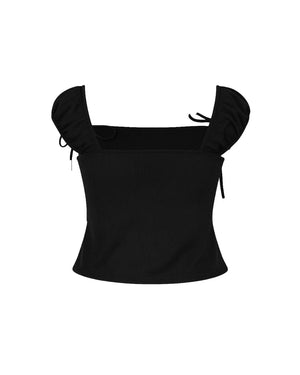 Black top with ruffled sleeves on a white background