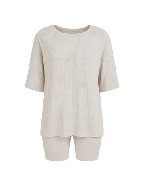 Beige ribbed top and shorts set on a white background