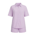 Lavender shirt and shorts set on a white background