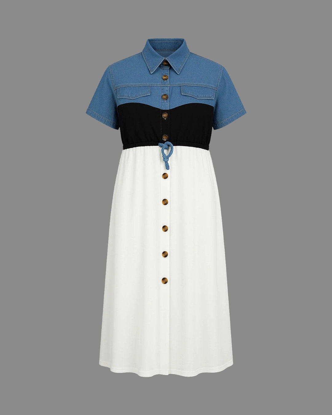Color-blocked dress with blue, black, and white sections on a gray background