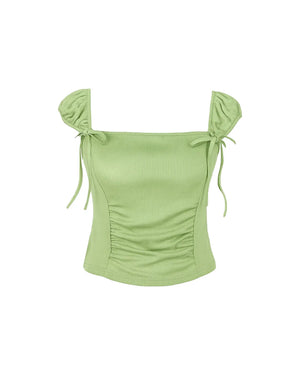 Green top with ruched design and tied sleeves on a white background