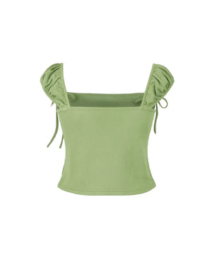 Green top with ruffled shoulders on a white background
