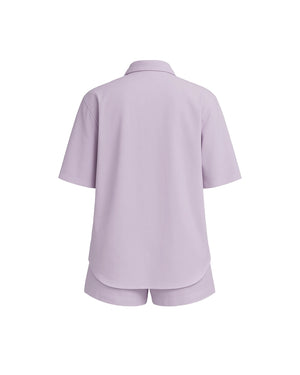 Lavender shirt and shorts set on a white background